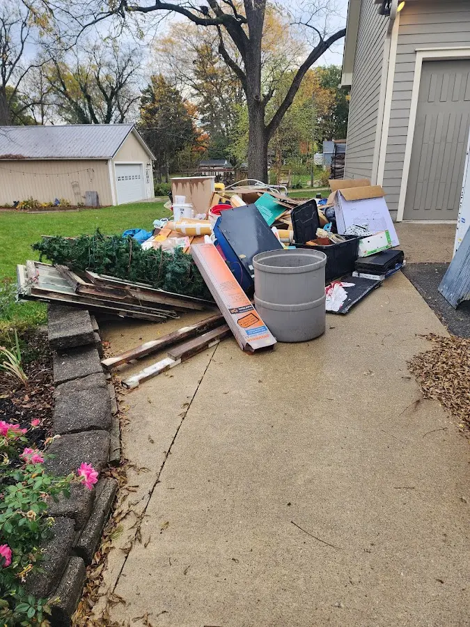 Dumpster being loaded with debris for 30 Yard Dumpster Rental in Rockwood